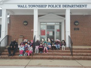 Patrolman McKay and Daisy Troop 816 on the steps of Wall Police Headquarters